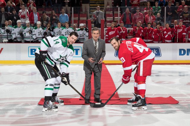 DETROIT, MI - NOVEMBER 29: Hall of Famer and former Detroit Red Wing Ted Lindsay drops the ceremonial first puck between captain Jamie Benn #14 of the Dallas Stars and captain Henrik Zetterberg #40 of the Detroit Red Wings prior to an NHL game at Joe Louis Arena on November 29, 2016 in Detroit, Michigan. (Photo by Dave Reginek/NHLI via Getty Images)