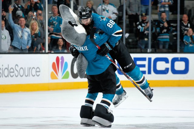 SAN JOSE, CA - NOVEMBER 29: SJ Sharkie and Brent Burns #88 of the San Jose Sharks celebrate after a NHL game against the Arizona Coyotes at SAP Center at San Jose on November 29, 2016 in San Jose, California. (Photo by Don Smith/NHLI via Getty Images)